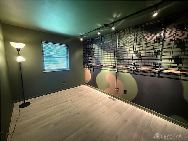 4220 Sillman Pl, Kettering, OH 45440 - unfurnished room featuring wood finished floors and rail lighting