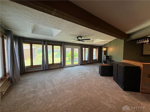 4220 Sillman Pl, Kettering, OH 45440 - unfurnished living room featuring carpet floors, a ceiling fan, a skylight, a textured ceiling, and healthy amount of natural light