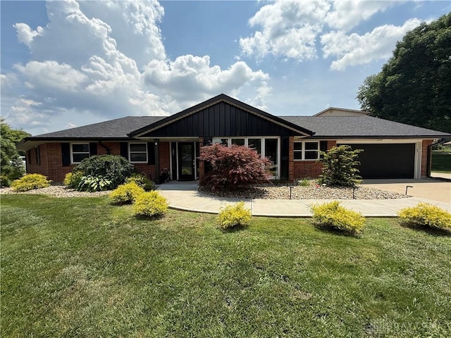 4220 Sillman Pl, Kettering, OH 45440 - ranch-style home with brick siding, a garage, concrete driveway, and a front yard