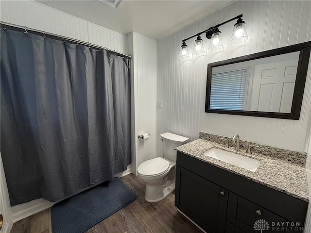 4220 Sillman Pl, Kettering, OH 45440 - bathroom with wood finished floors, vanity, a shower with shower curtain, and ornamental molding