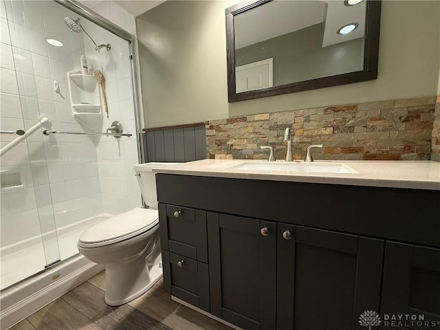 4220 Sillman Pl, Kettering, OH 45440 - bathroom with a stall shower, wainscoting, vanity, and wood finished floors