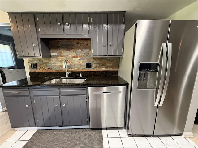 4220 Sillman Pl, Kettering, OH 45440 - kitchen featuring appliances with stainless steel finishes, decorative backsplash, light tile patterned floors, and gray cabinets