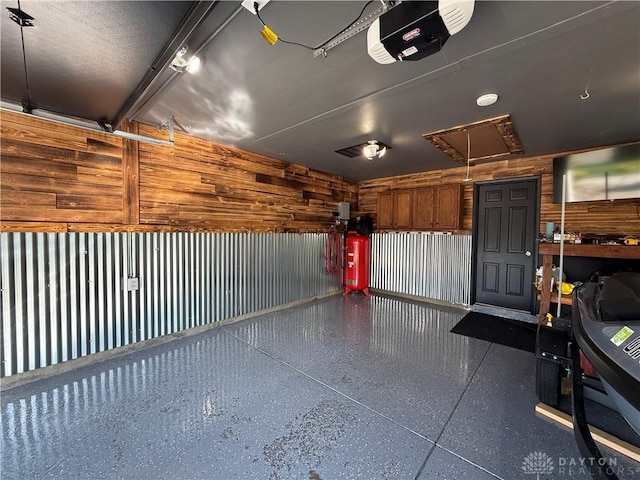 4220 Sillman Pl, Kettering, OH 45440 - garage with a garage door opener and wooden walls
