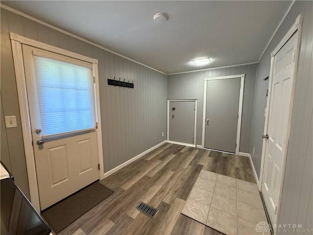 4220 Sillman Pl, Kettering, OH 45440 - doorway to outside featuring crown molding and wood finished floors