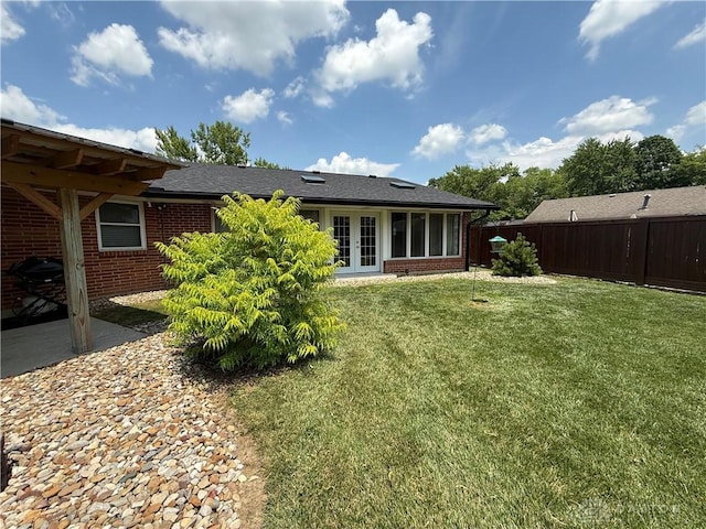 4220 Sillman Pl, Kettering, OH 45440 - back of house featuring french doors, brick siding, and a shingled roof