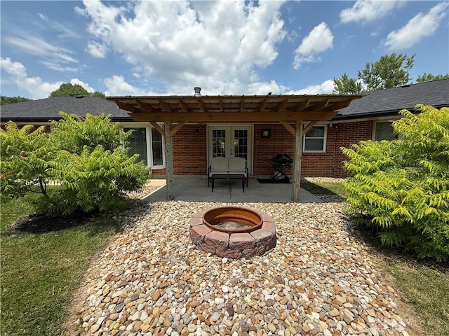 4220 Sillman Pl, Kettering, OH 45440 - back of house with an outdoor fire pit, french doors, a pergola, a patio area, and brick siding