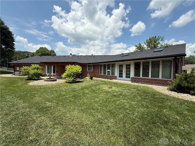 4220 Sillman Pl, Kettering, OH 45440 - back of house featuring french doors, brick siding, a yard, and a shingled roof