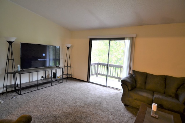 carpeted living room with vaulted ceiling