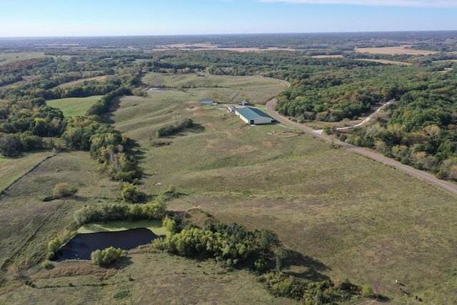 birds eye view of property with a rural view