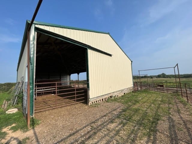 view of outdoor structure with a rural view