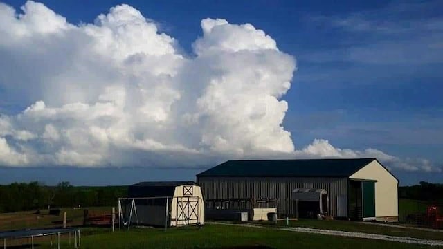 view of outbuilding with a trampoline