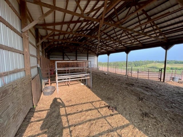 view of stable featuring a rural view