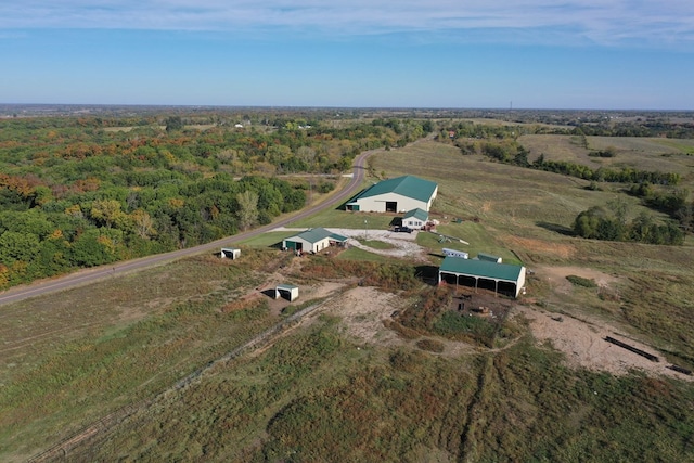 birds eye view of property with a rural view