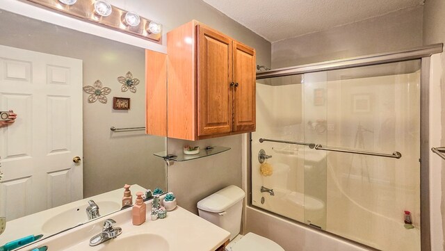 26484 State Highway 3, Kirksville, MO 63501 - bathroom featuring vanity, bath / shower combo with glass door, and a textured ceiling