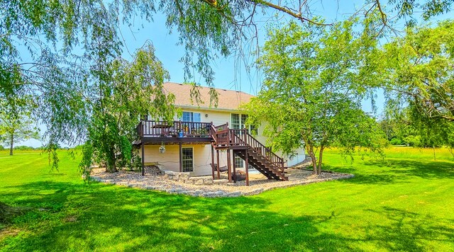26484 State Highway 3, Kirksville, MO 63501 - rear view of house with stairway, a wooden deck, and a lawn