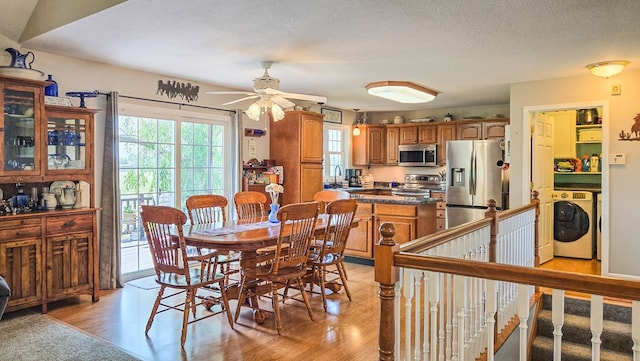 26484 State Highway 3, Kirksville, MO 63501 - dining space with washer / dryer, a ceiling fan, and light wood-style floors