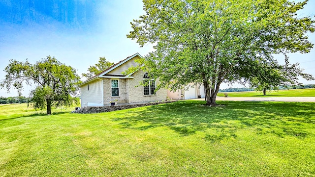 26484 State Highway 3, Kirksville, MO 63501 - view of property exterior with an attached garage, a yard, and brick siding