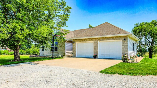 26484 State Highway 3, Kirksville, MO 63501 - view of front of house with a front lawn, driveway, a garage, and brick siding