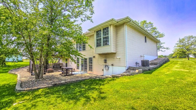 26484 State Highway 3, Kirksville, MO 63501 - back of house with a yard and a patio