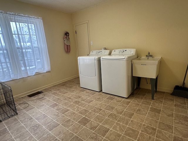 washroom featuring washer and dryer