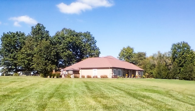 view of home's exterior featuring a lawn