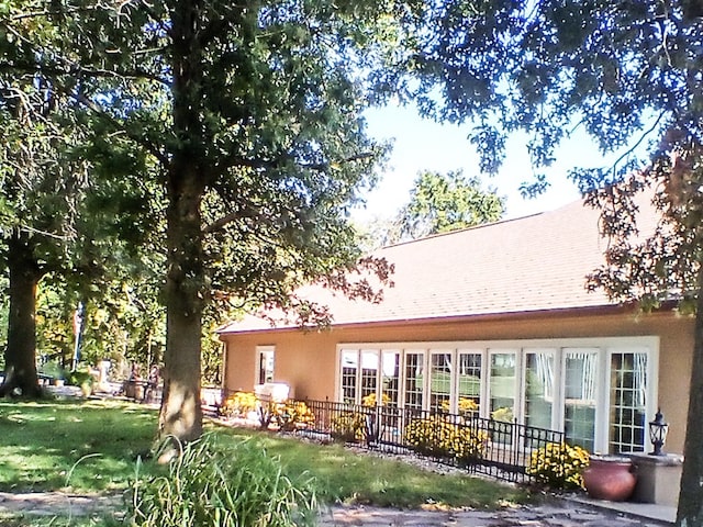 back of property with stucco siding