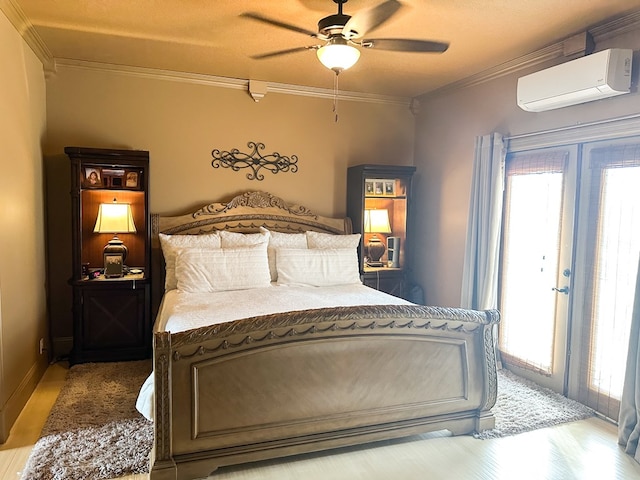 bedroom featuring multiple windows, french doors, crown molding, and a wall mounted air conditioner