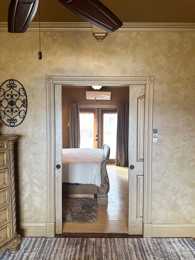 bedroom with french doors, baseboards, and crown molding