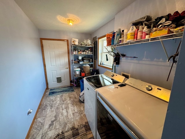 20858 Oak View Trl, Kirksville, MO 63501 - laundry area featuring washing machine and clothes dryer and baseboards