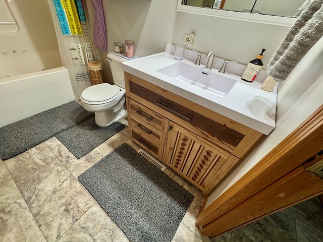 bathroom with toilet, vanity, and shower / bathtub combination with curtain