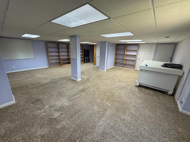 20858 Oak View Trl, Kirksville, MO 63501 - finished basement featuring carpet, built in shelves, and a paneled ceiling
