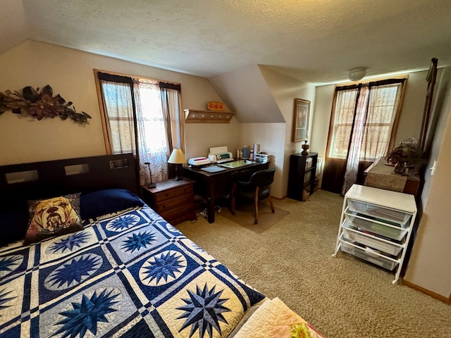 bedroom featuring light colored carpet, a textured ceiling, and lofted ceiling