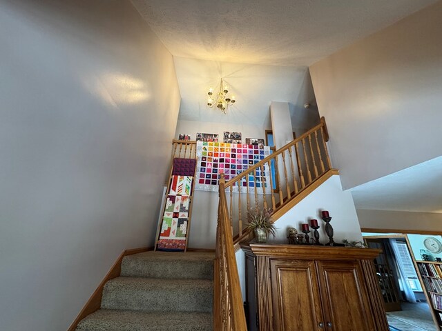 20858 Oak View Trl, Kirksville, MO 63501 - stairway featuring a chandelier and vaulted ceiling