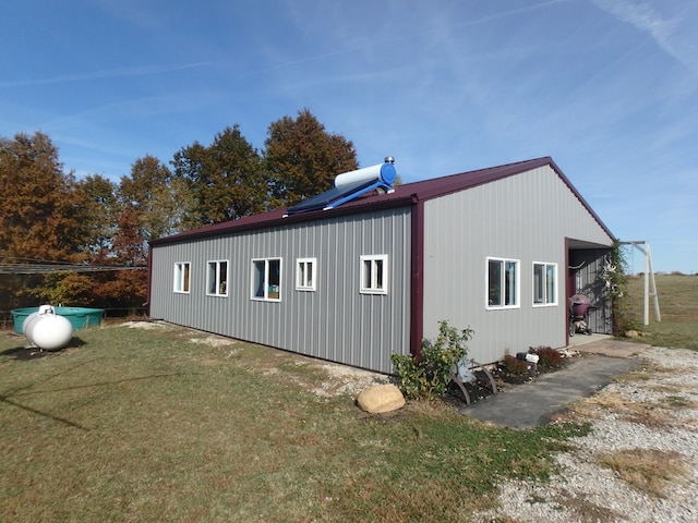 view of property exterior with a yard