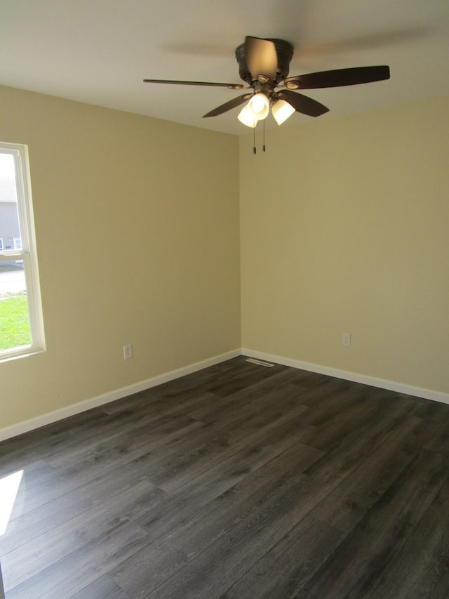 711 S Osteopathy, Kirksville, MO 63501 - spare room with dark wood finished floors, a ceiling fan, and baseboards