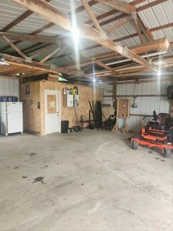 garage featuring white fridge