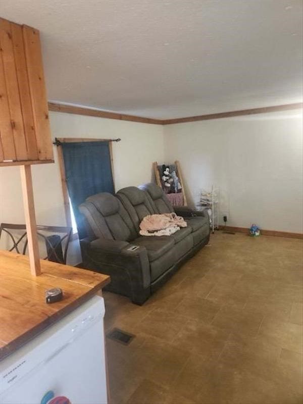 living room featuring crown molding