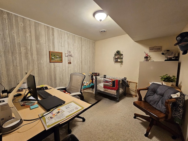 office featuring visible vents, carpet, and wood walls