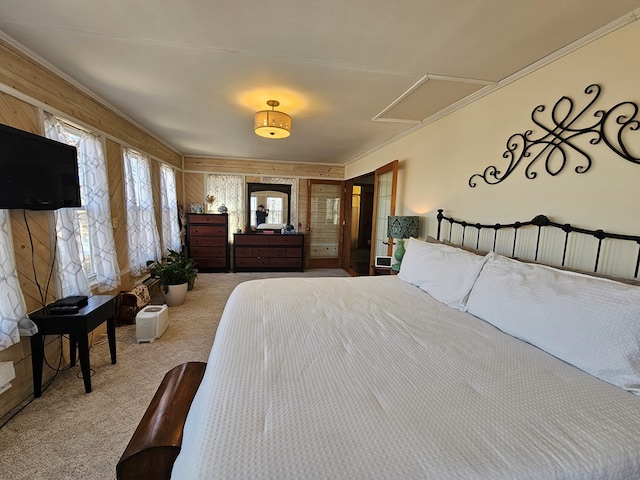 unfurnished bedroom featuring attic access and carpet flooring