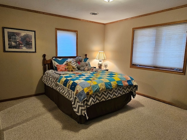 carpeted bedroom featuring baseboards, visible vents, and ornamental molding