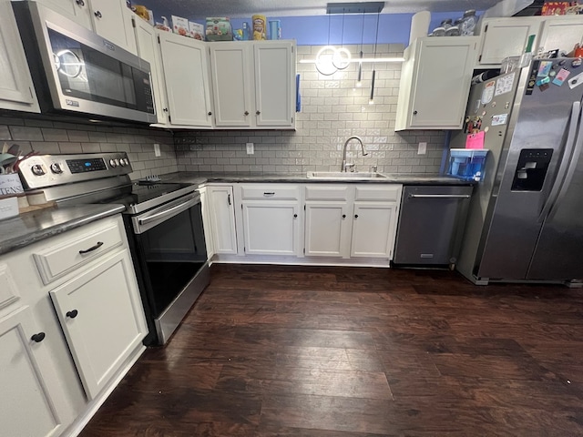 113 N Cottage Grove Ave, Kirksville, MO 63501 - kitchen with a sink, stainless steel appliances, backsplash, and white cabinets
