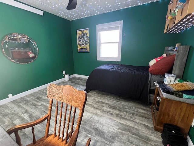 113 N Cottage Grove Ave, Kirksville, MO 63501 - bedroom with a ceiling fan, baseboards, and wood finished floors