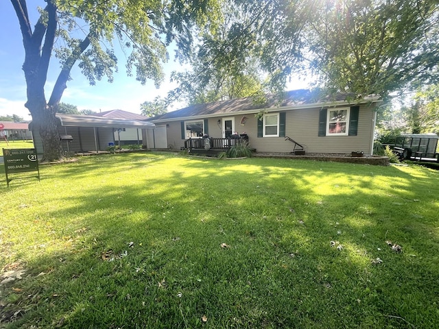 1713 Fairchild St, Chillicothe, MO 64601 - back of house with a lawn and a wooden deck