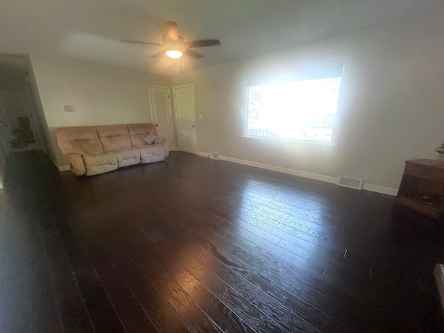 1713 Fairchild St, Chillicothe, MO 64601 - unfurnished living room featuring dark wood-type flooring and a ceiling fan