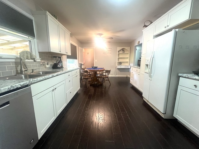 1713 Fairchild St, Chillicothe, MO 64601 - kitchen with stainless steel dishwasher, white refrigerator with ice dispenser, ceiling fan, white cabinetry, and dark wood-type flooring