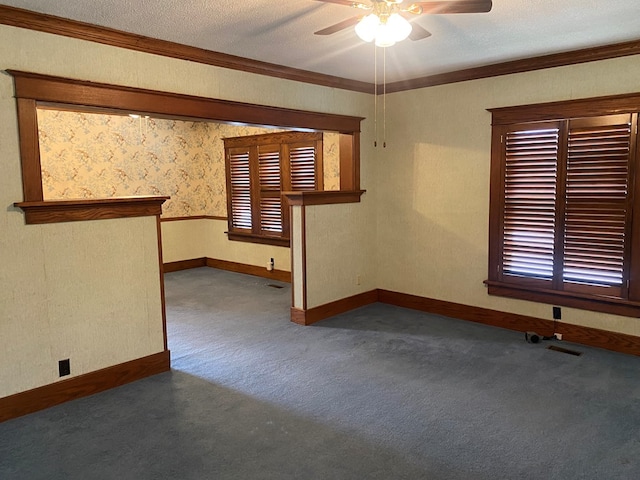 911 Cherry St, Chillicothe, MO 64601 - carpeted empty room with a ceiling fan, crown molding, baseboards, and a textured ceiling