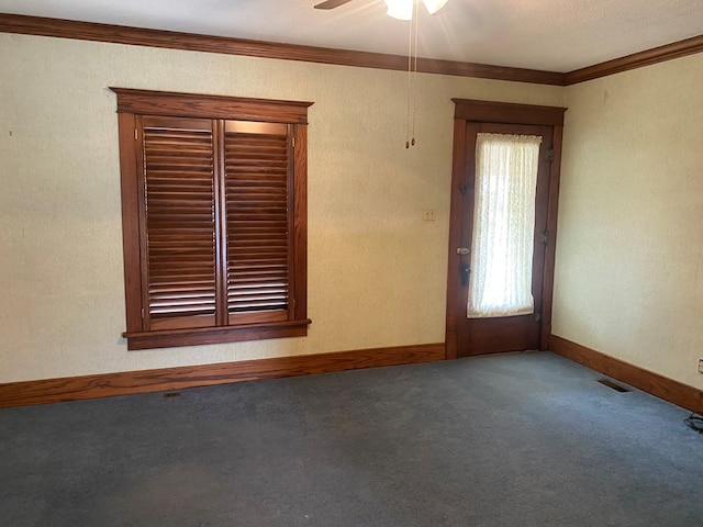 911 Cherry St, Chillicothe, MO 64601 - carpeted spare room with visible vents, crown molding, baseboards, and ceiling fan