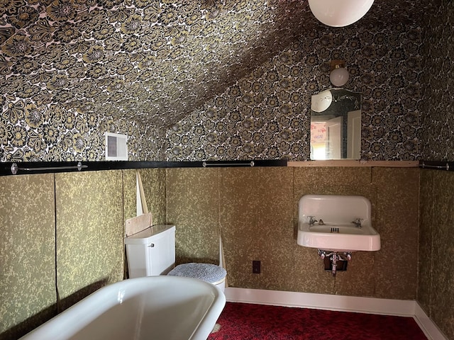 911 Cherry St, Chillicothe, MO 64601 - full bath with baseboards, a sink, and a freestanding bath