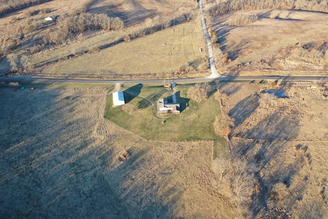 birds eye view of property featuring a rural view