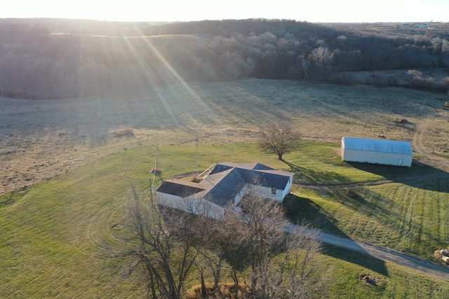 birds eye view of property with a rural view